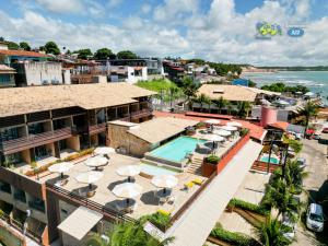 皮帕Apart Hotel PIPA'S OCEAN - Flat 322的享有带游泳池的度假村的空中景致