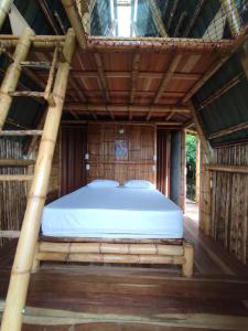 杰里科El Turpial的木屋顶客房的一张床位