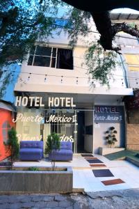 墨西哥城HOTEL PUERTO MEXICO 2的酒店大楼的标志是酒店首屈一指的墨西哥酒店