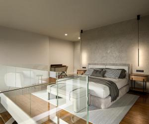 圣地亚哥－德孔波斯特拉I Loft Santiago by Upper Luxury Housing的一间卧室设有一张床和玻璃墙