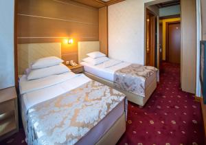 切泽巴尼亚卢卡酒店客房内的一张或多张床位