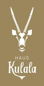 卡普伦Haus Kulala的一个有库杜头的标牌,上面写着“haus k”字