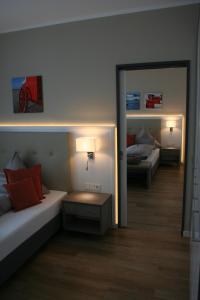 Hotel Inselhof Borkum客房内的一张或多张床位