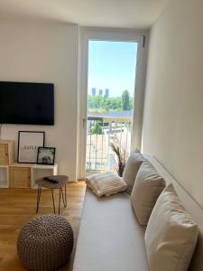 Donaublick Oasis: Stylische Wohnung的休息区