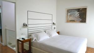 克尤别墅公寓式酒店客房内的一张或多张床位