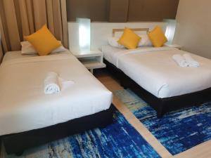 Lovita Hotel Kuantan客房内的一张或多张床位