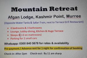穆里Mountain Retreat at Afgan Lodge的读到高山度假的标志,位于克什米尔尼安点
