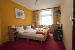 库弗斯藤达姆斯普瑞维特兹酒店客房内的一张或多张床位