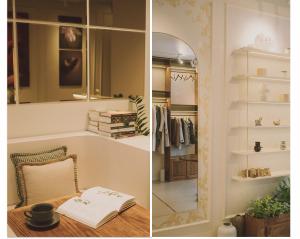 大叻Le Macaron Boutique Hotel Đà Lạt - Dalat的一间设有镜子和一张桌子及一本书的房间