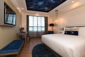 Royal Tian Li Hotel客房内的一张或多张床位