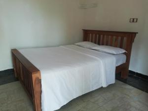 Komaligma villa by camrin Group客房内的一张或多张床位