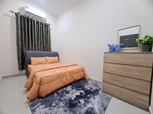 Homestay Jeli - Cattleya Inn Muslim客房内的一张或多张床位