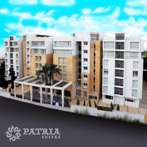 拉杰果德Patria Suites的一座拥有建筑和棕榈树的城市的模型
