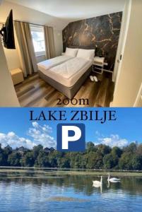 ZbiljeBoutique hotel ZBILJE的一间卧室配有一张床,湖泊拥有天鹅