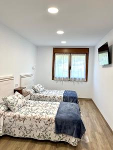 Apartamento Valbuena客房内的一张或多张床位