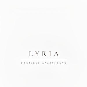 利吉亚Lýria Boutique Apartments的粉红色家具组织的标志