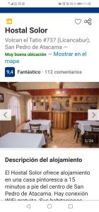 圣佩德罗·德·阿塔卡马索洛旅馆的一张带有餐厅照片的网站的截图