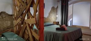 莱里达La Impronta Relax的石墙客房的卧室配有一张床