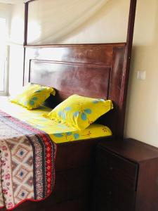 Deux-Palmes-Kribi, proche de la plage, confortable et adapté aux familles客房内的一张或多张床位