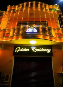 KottakupamParadise Golden Residency的大楼里一家餐厅的一个标志