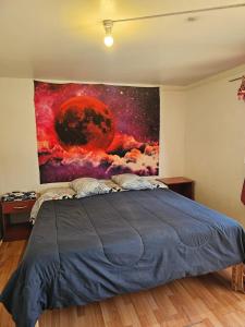 科皮亚波el valle的一间卧室配有一张壁画床