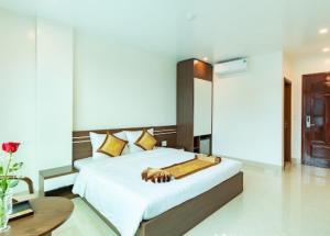 Tung Quang Hotel客房内的一张或多张床位