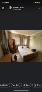 BantamaPATAYO LODGE的一张带大床的卧室的照片