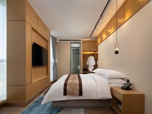 格林东方天津武清区万达广场酒店客房内的一张或多张床位