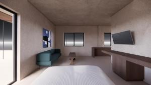 罗德镇Elite Centre的客房设有床、沙发和电视。