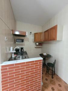 Apartamento em São Lourenço-mg的厨房或小厨房