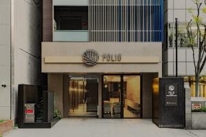 大阪Folio Sakura Shinsaibashi Osaka by Banyan Group的大楼,前门进入酒店