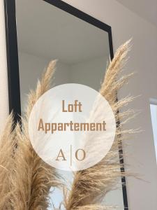 比勒费尔德Loft Appartement的留意在羽毛旁的左约会标志