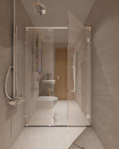 绥和市Dinh’s Aparment的一间带玻璃淋浴和水槽的浴室