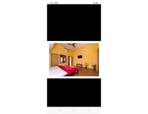 奥拉奇哈Mridul Homestay Orchha, Madhya Pradesh的一张带床和电视的房间的屏幕