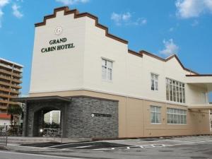 那霸Grand Cabin Hotel Naha Oroku for Men / Vacation STAY 62323的一座建筑,上面有读大峡谷酒店的标志
