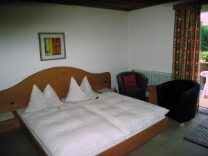 圣纳维克尔旅馆 - 罗斯勒别墅客房内的一张或多张床位