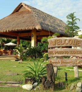Lingayen艾尔普艾尔托玛丽纳海滩度假胜地及度假俱乐部的度假村前的迎宾标志