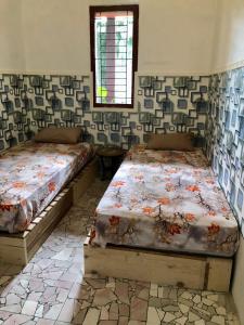 Ohana Homestay Banyuwangi客房内的一张或多张床位