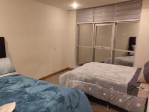 Hermoso departamento en La Paz-Bolivia客房内的一张或多张床位