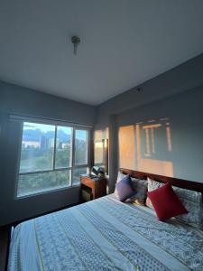 Condo in Alabang Muntinlupa客房内的一张或多张床位