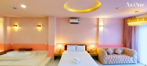 As ONE Hotel Biên Hòa客房内的一张或多张床位