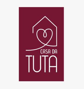蒂拉登特斯Casa da Tuta Pousada的带有心脏的图卢姆公司的标志