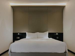 The Concept Hotel HCMC- District 1客房内的一张或多张床位