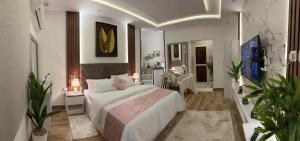 利雅德Riyadh的一间卧室设有一张床和一间客厅。