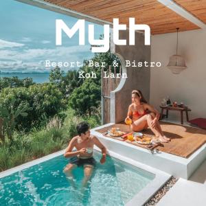 格兰岛Myth Koh Larn resort bar and bistro的一份杂志封面,两人坐在游泳池里