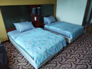 South China Sea Place Suites at Ming Garden, near Imago, Sutera Avenue KK客房内的一张或多张床位