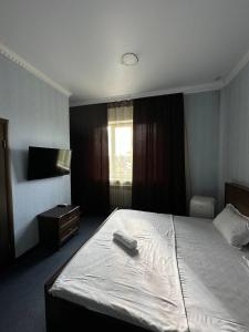 Бутик-отель Мажор客房内的一张或多张床位