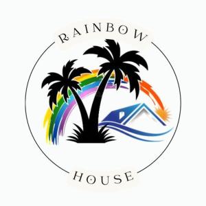 莱昂Rainbow House的棕榈树和彩虹房子的标志