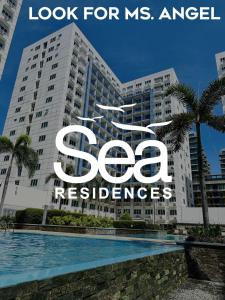马尼拉Sea Residences - Property Val Alano 0995-448-8872的一座大建筑,上面有读取ms天使住宅的标志