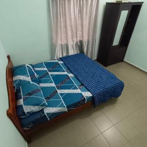 Maju Homestay Kuala Terengganu客房内的一张或多张床位